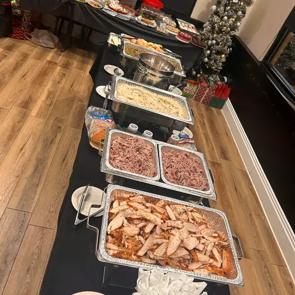A catering line of trays set up in a party room