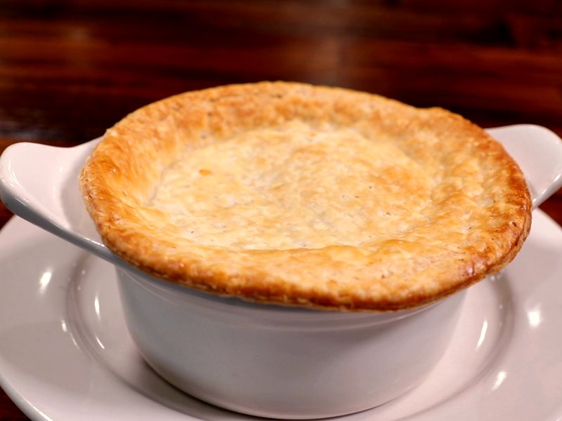 A chicken pot pie with a golden, flaky crust
